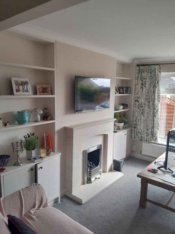 Fitted alcove shelving and cupboards either side of a fireplace by MyDeskin Carpentry, Keynsham